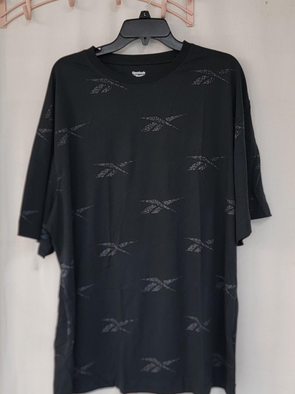 Reebok Black Short-Sleeve Tee with Subtle Logo Pattern
